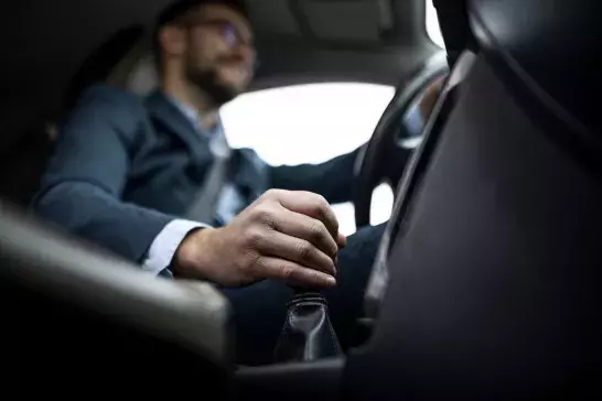 businessman-driving-his-car