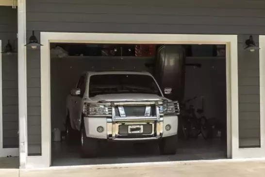 white truck parked inside a garage