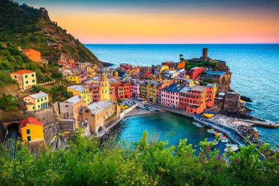 Colourful buildings along the coastline at sunset in Cinque Terre, Italy