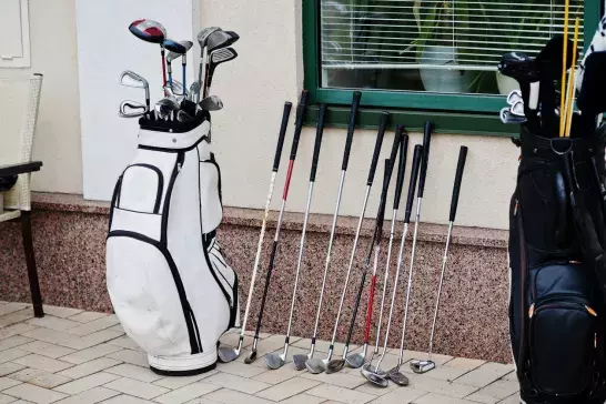 golf clubs leaning against home