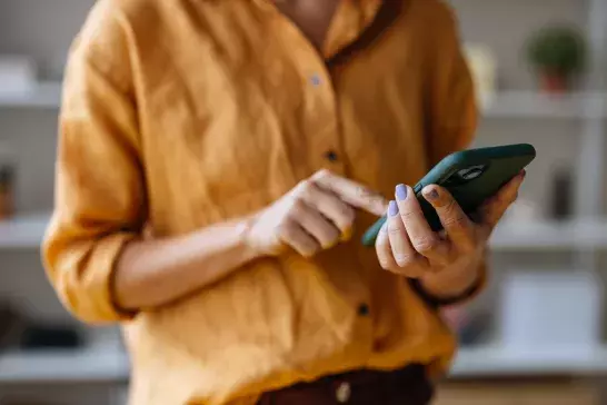 woman holding phone