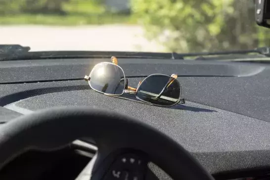 Sunglasses on a dashboard