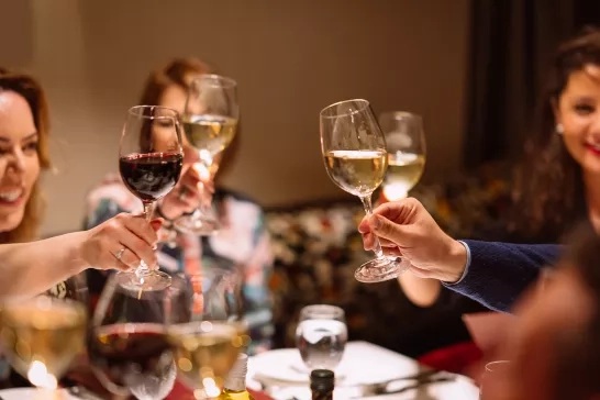 A group of AmaWaterways guests cheersing their glasses onboard.