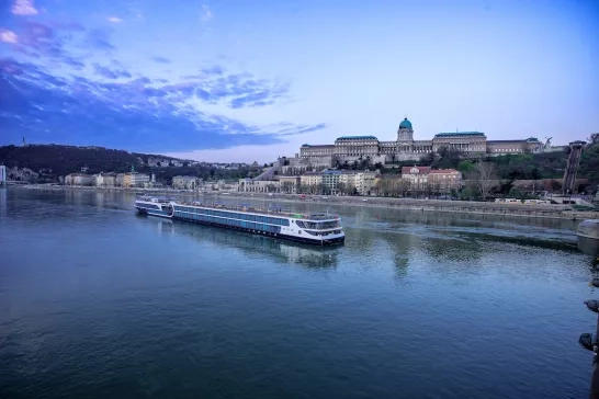 Exterior shot of Avalon Waterways' Envision ship sailing through the canal.