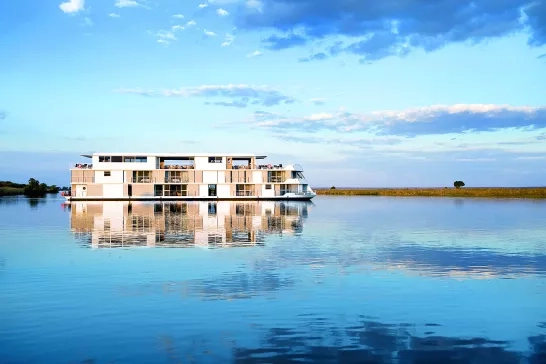 AmaWaterways' Zambezi Queen ship reflecting off the water below in Africa.