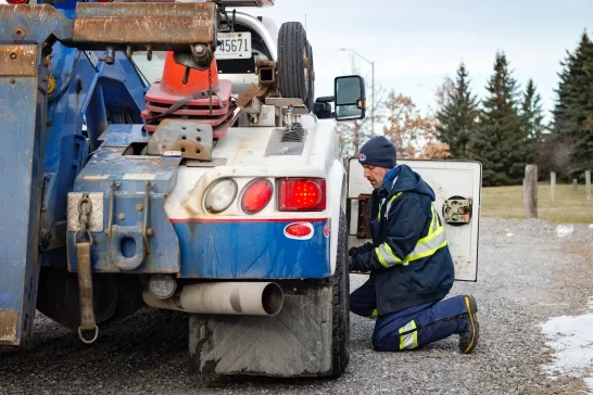 caa-tow-truck-driver-getting-gear-from-tow-truck