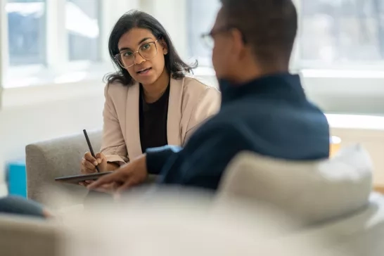 Counsellor talking with client at office