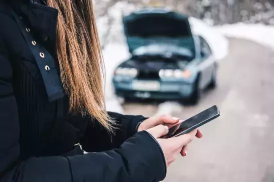 woman calling for help after being in a car accident