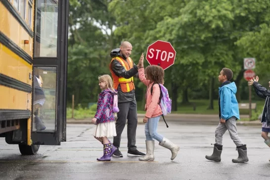 Kids boarding a school bus