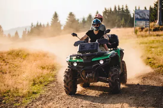 couple riding an ATV