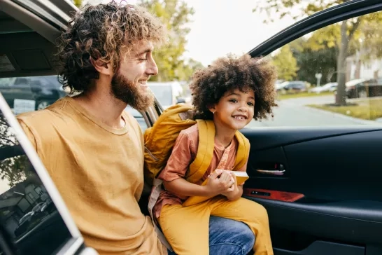 father with son in a car