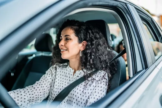 Mid adult woman driving a car