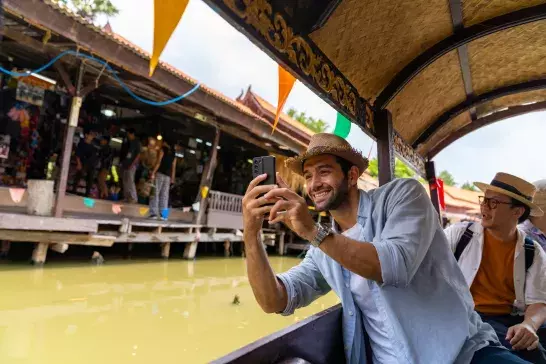 man taking photo on his phone in Ayutthaya Province, Thailand 