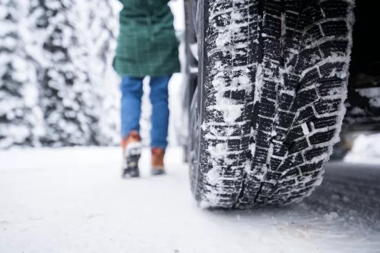 close up shot of winter tire in snow