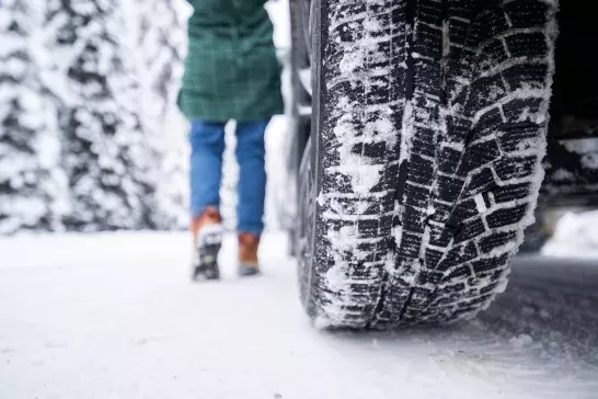 close up shot of winter tire in snow