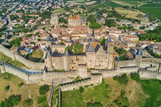 Aerial top view of Carcassonne medieval city and fortress castle from above, Sourthern France