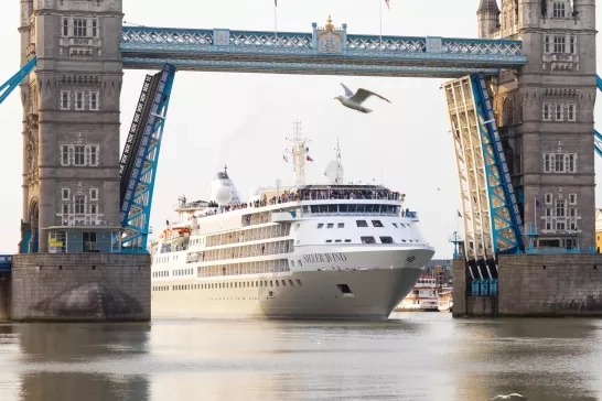 Silversea's Silver Wind ship going underneath a bridge.