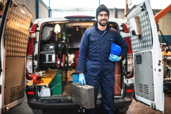 Mechanic technician outside his commcerical van