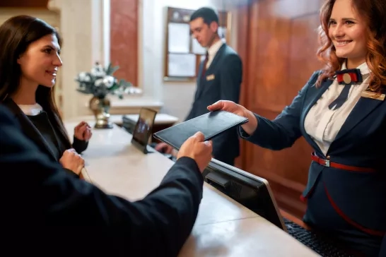 Couple checking into hotel