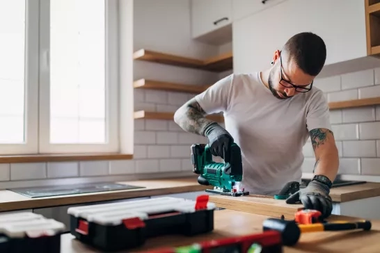 Carpenter working in kitchen