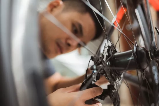 a man fixing a bike