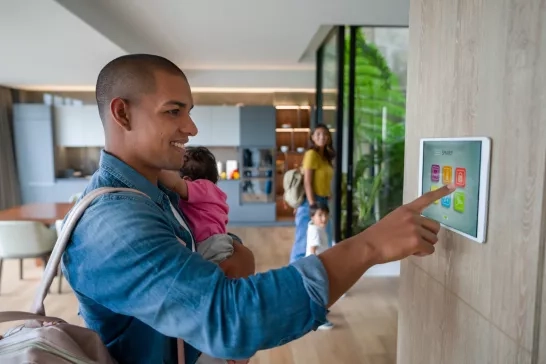 amily leaving the house locking the door using a home automation system
