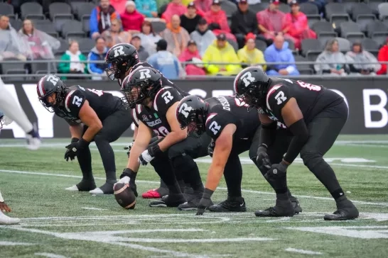 Ottawa REDBLACKS offensive line - center is about to snap the football