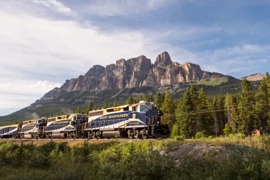 Rocky Mountaineer train gliding through the Canadian Rockies.