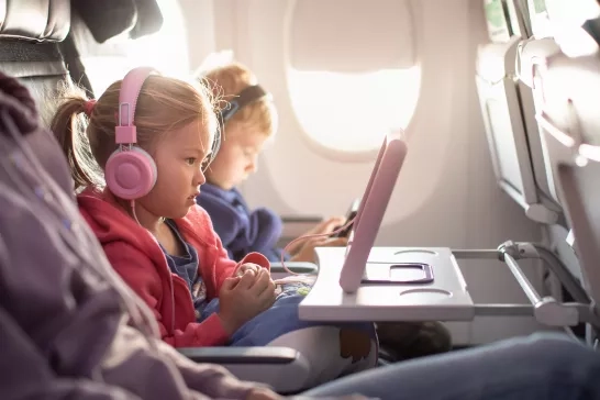 Adorable little boy girl travel by plane