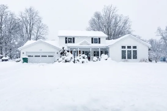 Suburban Colonial Home During Extreme Blizzard Snow Storm 