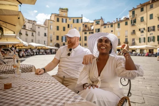 friends eating at a street cafe in Lucca