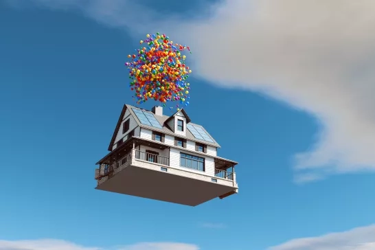 Floating house with balloons