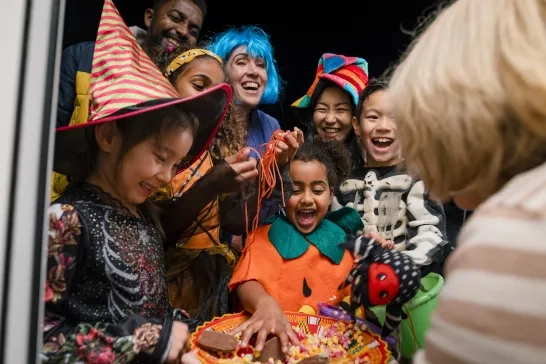Kids taking Halloween candy