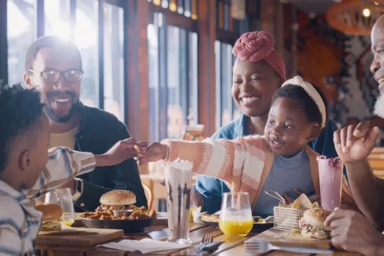 parents with children in restaurant for lunch