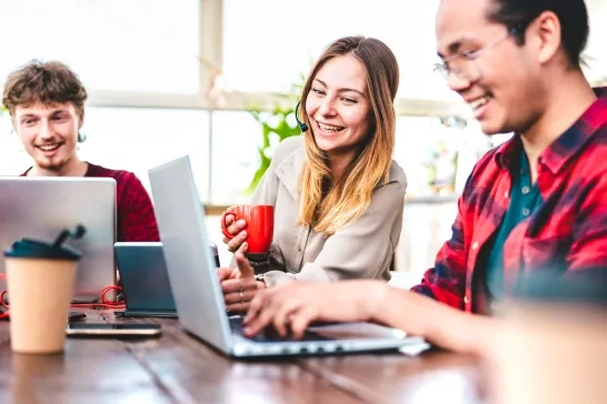 coworkers working on laptops