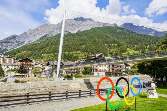 The five-ringed symbol of the Olympic Games placed on the bank of the river Adda in Bormio 