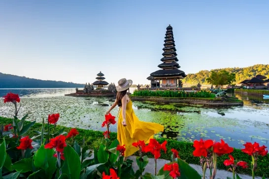 tourist relaxing and enjoying the beautiful view at Ulun Danu Beratan temple in Bali, Indonesia
