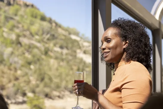 Woman onboard Canyon Spirit's glass-dome train