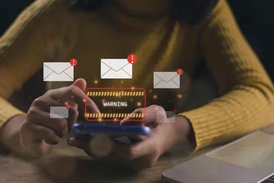 Businesswomen using laptops show warning signs after getting attack phishing emails 