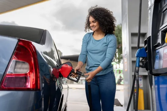 Woman refueling her car