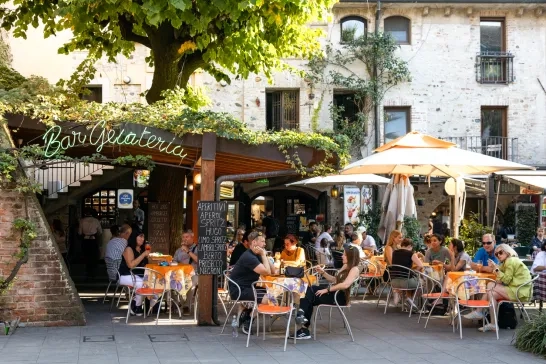 Italian Cafe with several tables outside