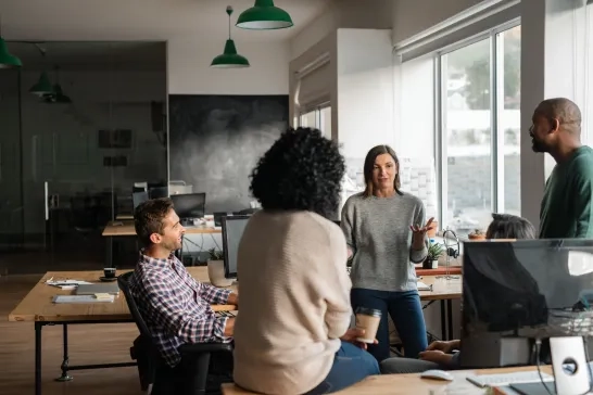 group of people talking in an office