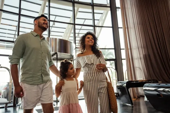 Family walking in hotel lobby