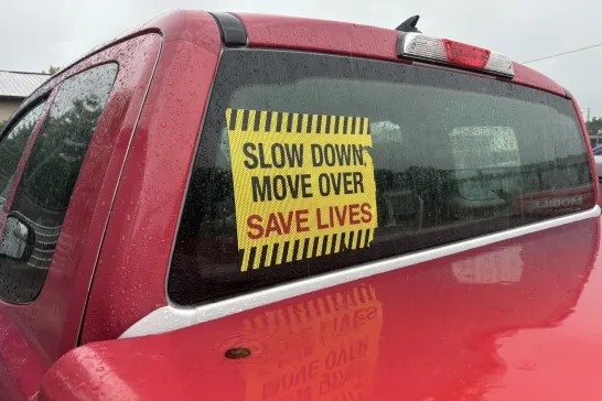 Slow down move over sign in truck