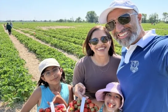 CAA Member berry picking with family