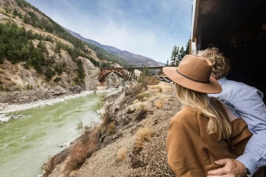 Couple looking out window on the Rocky Mountaineer