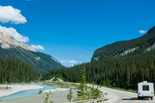 RV driving down a scenic road in Banff National Park, Alberta 