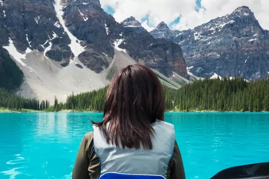 Woman canoeing in the Canadian Rockies 