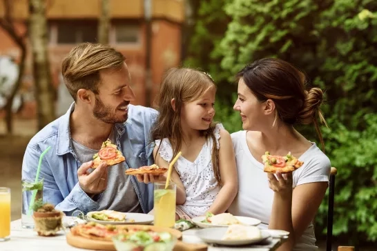 Family enjoying a meal outside