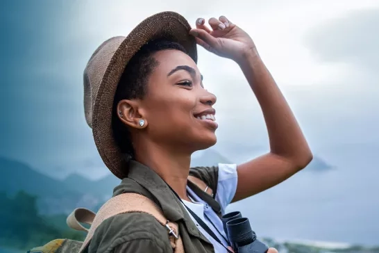 Woman with a backpack and binoculars 